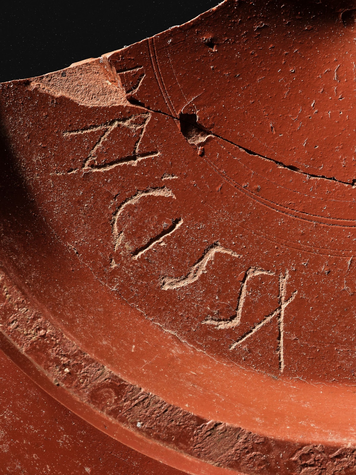 Samian ware dish, graffito DRIGISSA, Inveresk. Photo © National Museums Scotland