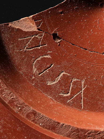 Samian ware dish, graffito DRIGISSA, Inveresk. Photo © National Museums Scotland