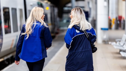 This image shows two female Northern staff members at a station