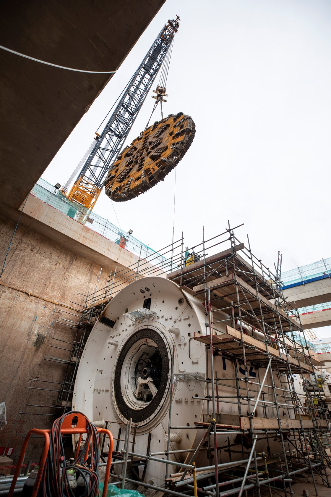 The cutterhead being lowered into place by crane