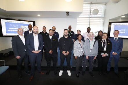 Cllr Mete Coban and Mayor Philip Glanville with council officers, including newly insourced parking officers