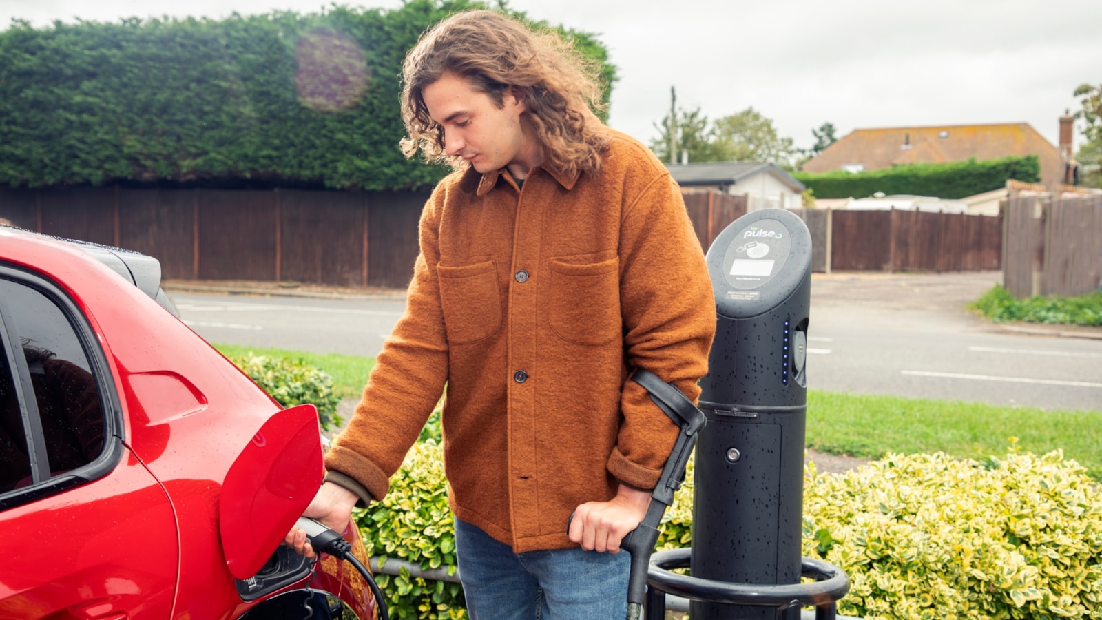 Motability Scheme customer charging an EV cropped-2