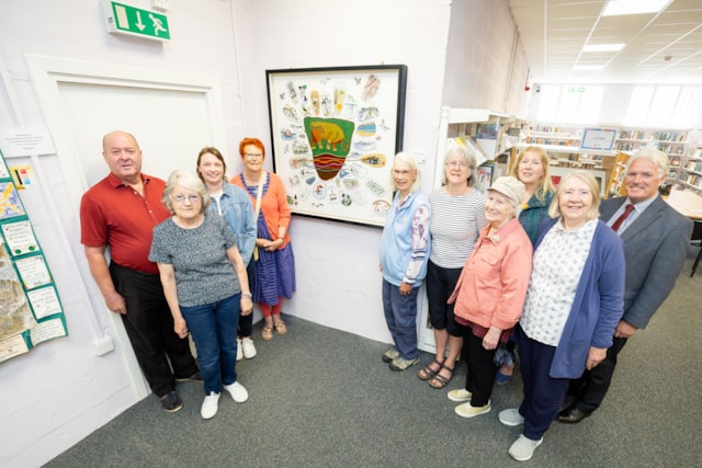 Cllr Laurie Fraser, Threads of Nairn stitchers group, Cllr Barbara Jarvie and Cllr Ian Brown with Burghead Bull tapestry