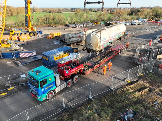 Wagon being lifted onto back of lorry