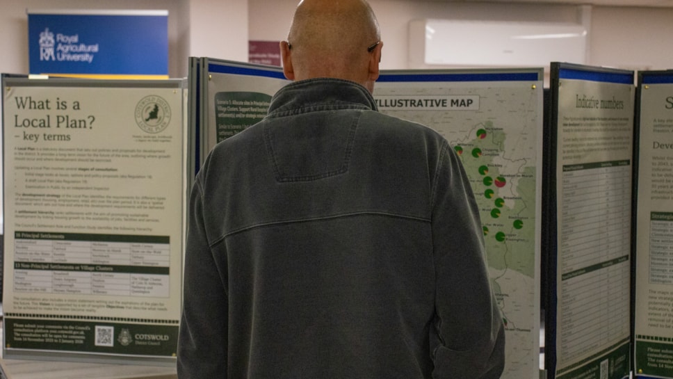 CDC Local Plan man looking at posters