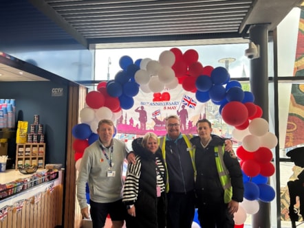 Southeastern colleagues standing by the balloon arch
