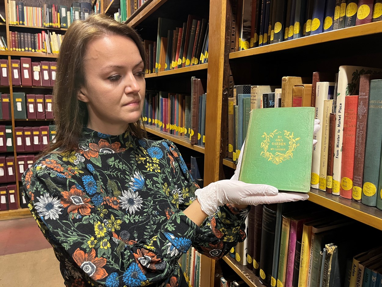 Leeds Central Library's poisonous book: Rhian Isaac, Leeds Central Library's senior librarian with the library's copy of My Own Garden: The Young Gardener’s Yearbook. Published back in 1855, it has been safely tucked away behind the scenes at Leeds Central Library, well away from visitors.
Recent research carried out by experts at the library revealed that the seemingly unassuming book most likely owes its vivid, emerald, green colour to a dye containing quantities of arsenic, which can be lethal when ingested.