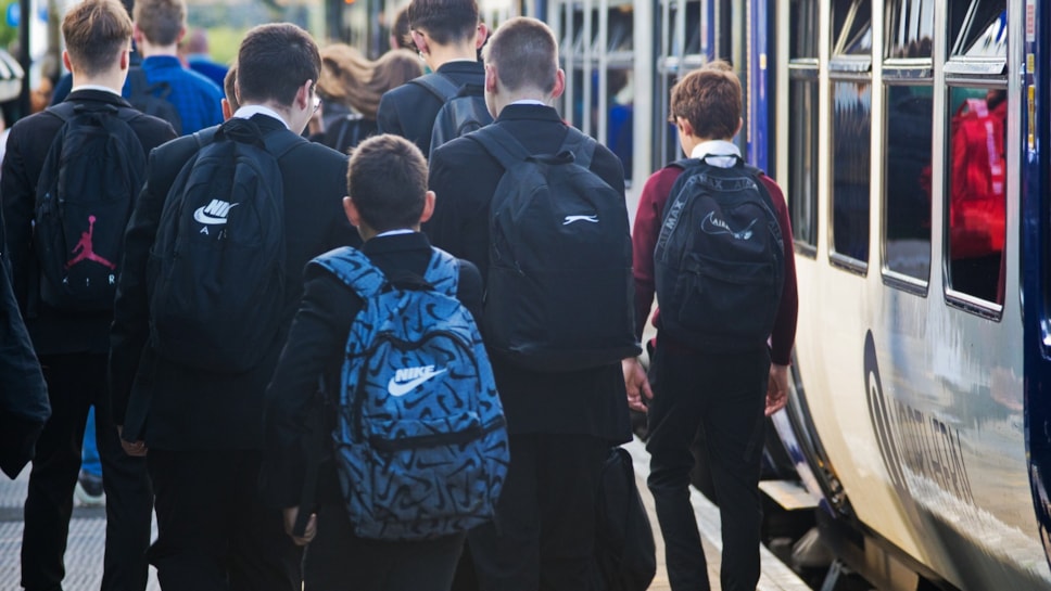 Image shows schoolchildren commuting to school