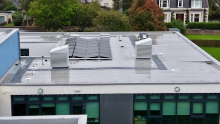 Aerial view of Cullen Primary School’s flat roof with solar panels and ventilation units