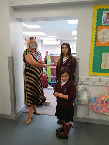 Opening of new Millbank Primary School library: Chief Education Officer, Vivienne Cross, with Lucie Scott (11) and Zuri Andrew (5), Millbank's youngest and oldest pupils.