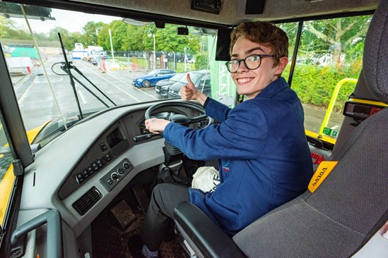 Pupil from Futures Academy in the cab of an articulated dumper truck: Pupil from Futures Academy in the cab of an articulated dumper truck