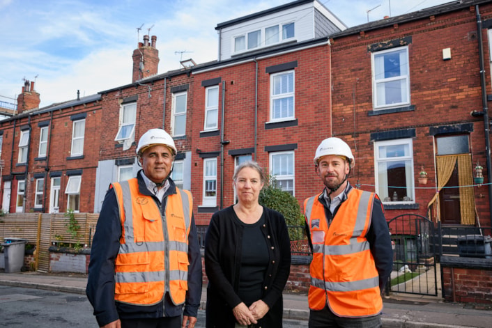 Heart of Holbeck 2: Councillor Asghar Khan (Leeds City Council’s executive member for housing and hubs) and Matthew Wilkinson (sustainability manager, Equans) with Andrea Bennett, one of the Holbeck residents whose home has benefited from improvement work as part of the Heart of Holbeck regeneration programme.
