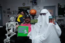 Toyologist Peter Jenkinson dressed as a ghost with the storyteller and games demonstrator at Pluckley Station