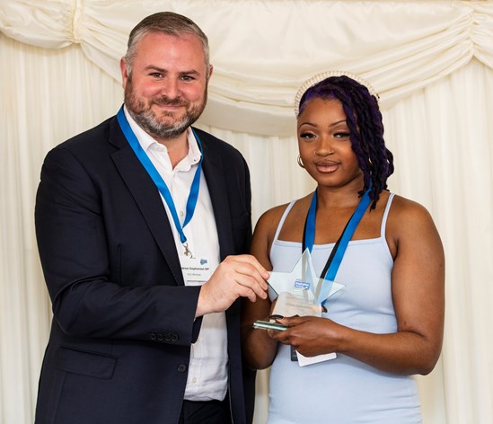 Divine receives her award from HS2 Minister Andrew Stephenson