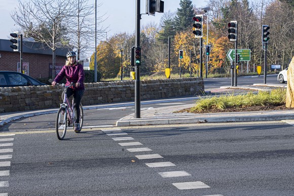 Person cycling on Moortown roundabout