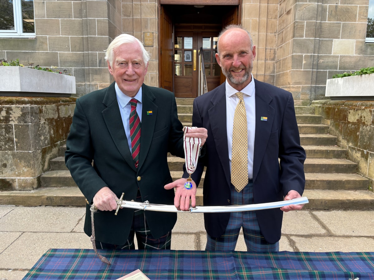 Former Lord-Lieutenant of Moray Major General Seymour Monro hands over the sword and badge to new Lord-Lieutenant of Moray Air Commodore Alistair Monkman CBE after five years in the role.