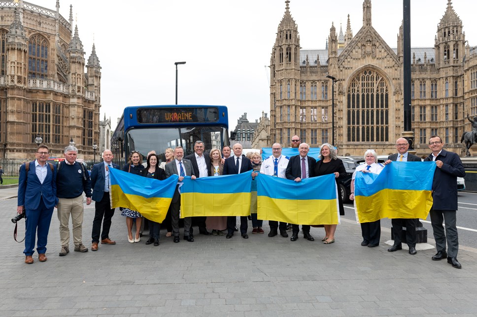 A hospital bus donated by The Go-Ahead Group is presented to the Ukrainian ambassador to the UK outside parliament.
