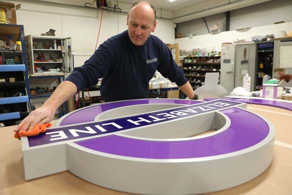 TfL Press Release - Elizabeth line stations take shape as the first iconic purple roundels are installed: Elizabeth line signage in production at AJ Wells & Sons