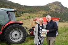 Environment Secretary Roseanna Cunningham and SNH chairman Ian Ross launch the Scotish Biodiversity Strategy Route Map 2020 one-year review report: Environment Secretary Roseanna Cunningham and SNH chairman Ian Ross launch the Scotish Biodiversity Strategy Route Map 2020 one-year review report at Holyrood Park, in front of a new forage harvester machine. The machine was purchased by Historic Environment Scotland (HES) this year to cut and remove grass from hard-to-reach places, dominated by acidic grassland as a result of the volcanic rock in the park. Sections of the park are Sites of Special Scientific Interest (SSSIs) with protected species, such as the lowland grassland and vascular plants.
