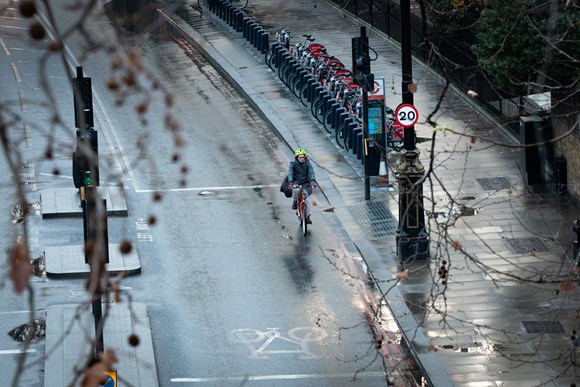 TfL Image - A woman cycles along the Embankment where the speed limit has been reduced to 20mph
