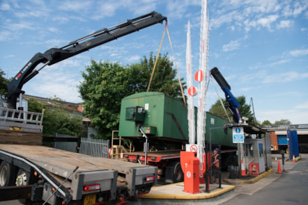 Diesel ful tank is lowered on to trailer for removal