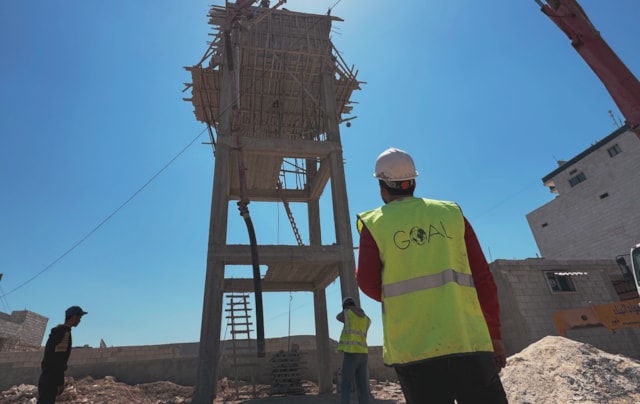 GOAL teams are constructing a water tower to ensure that residents of Al-Wadah displacement camp, host to more than 5,000 people, can have regular access to clean piped water. Jandires, Northern Aleppo, Syria. April 2024.-3