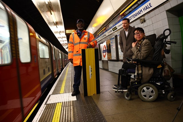 James Lee from TfL's Independent Disability Advisory Group and Seb Dance, Deputy Mayor for Transport in London wait to see a new mini ramp being used at Tottenham Hale station