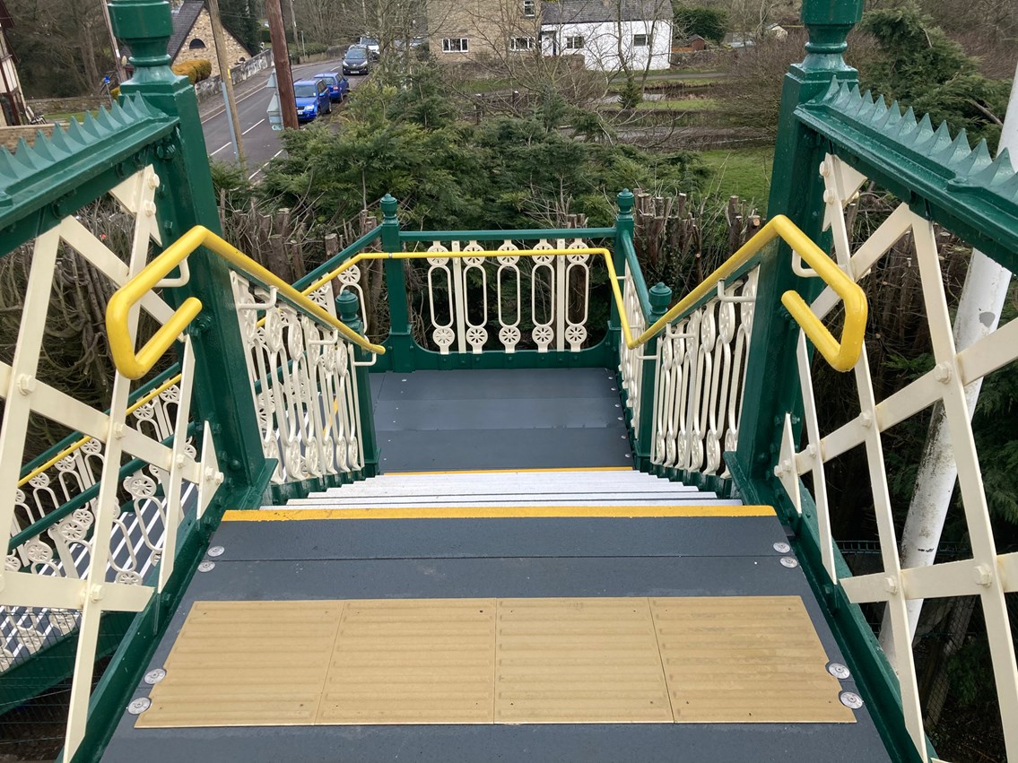 View looking down staircase of renovated Furness Vale station footbridge