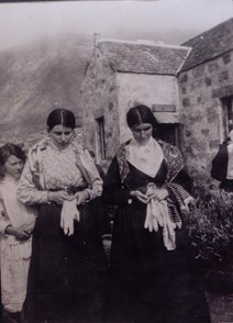 St Kilda Christina Ann McQueen: Christina Ann McQueen (centre), daughter of Finlay McQueen, outside the factor’s house, St Kilda, c1913
National Records of Scotland, GD1/713/1
