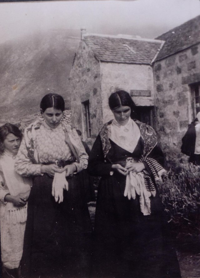 St Kilda Christina Ann McQueen: Christina Ann McQueen (centre), daughter of Finlay McQueen, outside the factor’s house, St Kilda, c1913
National Records of Scotland, GD1/713/1