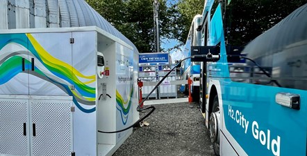 A Hydrogen bus being refuelled in a similar set up to a garage forecourt.