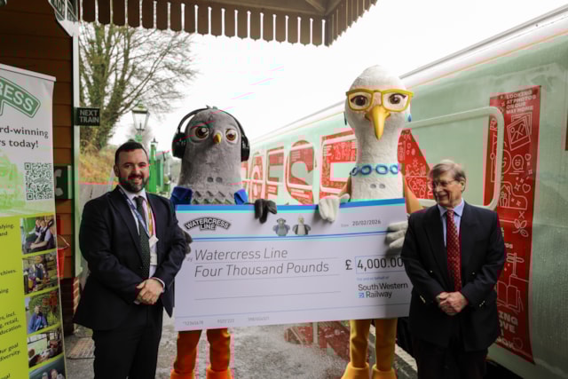 Tom Desmond and Stephen Evans shake hands after the presentation of a £4,000 cheque to The Watercress Line: Tom Desmond and Stephen Evans shake hands after the presentation of a £4,000 cheque to The Watercress Line