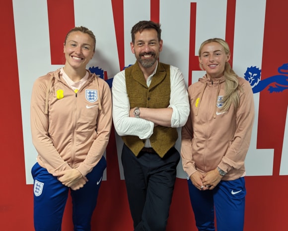 England's Chloe Kelly and Leah Williamson discuss the story behind the London Overground Lioness line on TfL’s Mind the Gap podcast: TfL Image - Tim with Leah and Chloe