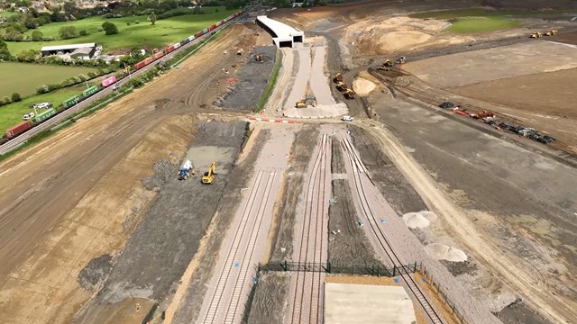 Drone shot of West Coast main line and soon to be built freight connection in Northampton: Drone shot of West Coast main line and soon to be built freight connection in Northampton