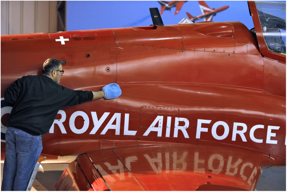 Principal Conservator, Stuart McDonald cleans a Red Arrows Hawk at the National Museum of Flight. Image (c) Paul Dodd (6)