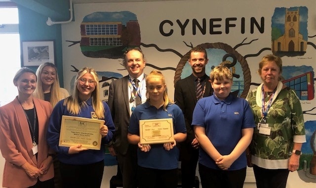 Pupils and staff with gold carers award, with Director Steven Richards-Downes