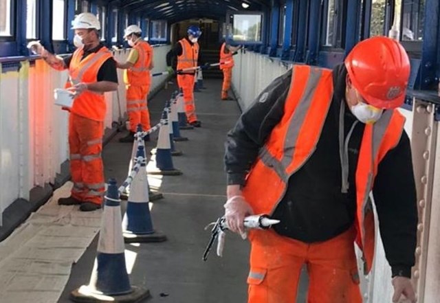 Over £1.8 billion spent across the south on improvements with passengers returning to the railway more than 18 months after the first lockdown, Network Rail’s Wessex route says “welcome back”: Social distancing while painting Guildford footbridge!