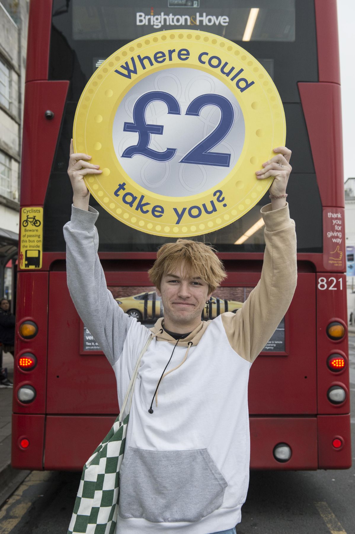 Reece Emerton, bus passenger celebrates £2 fares