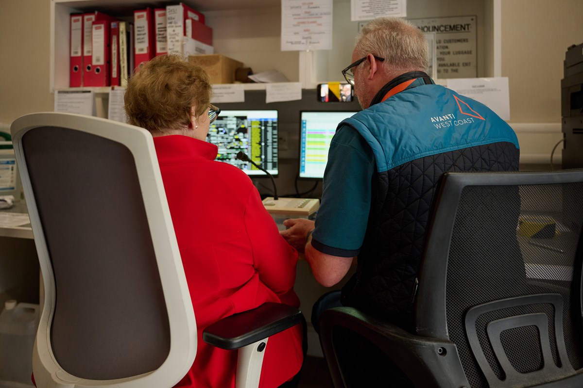 (Left to Right): June Rosen gains an insight into the role of Station Announcer from Avanti West Coast Customer Service Assistant, Lee Hardman