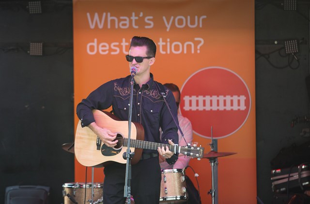 The man in black: The Johnny Cash tribute act - Cash Band London - perform in front of a Thameslink Programme banner