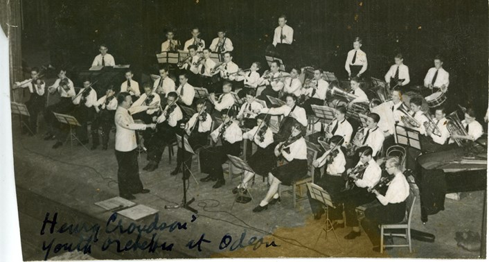 Sounds of Our City: Photograph of Leeds Youth Symphony Orchestra, Conductor Mr Henry Croudson, taken at the Odeon Cinema, Leeds, 1943.