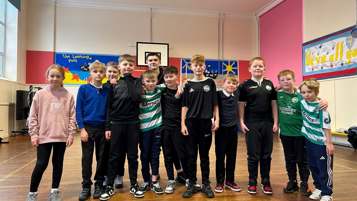 Buckie Thistle midfielder Marcus Goodall with Cluny Primary P6 pupils.