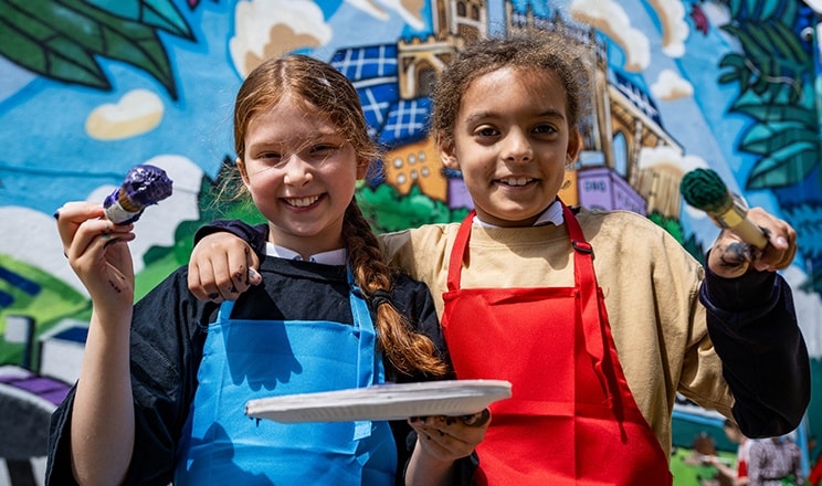 children-smiling-at-mural-hero-D