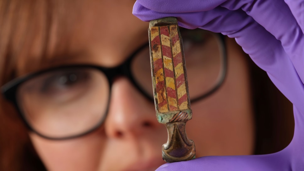 Assistant Curator Bethany Simpson with the Pathhead brooch. Image © National Museums Scotland 3