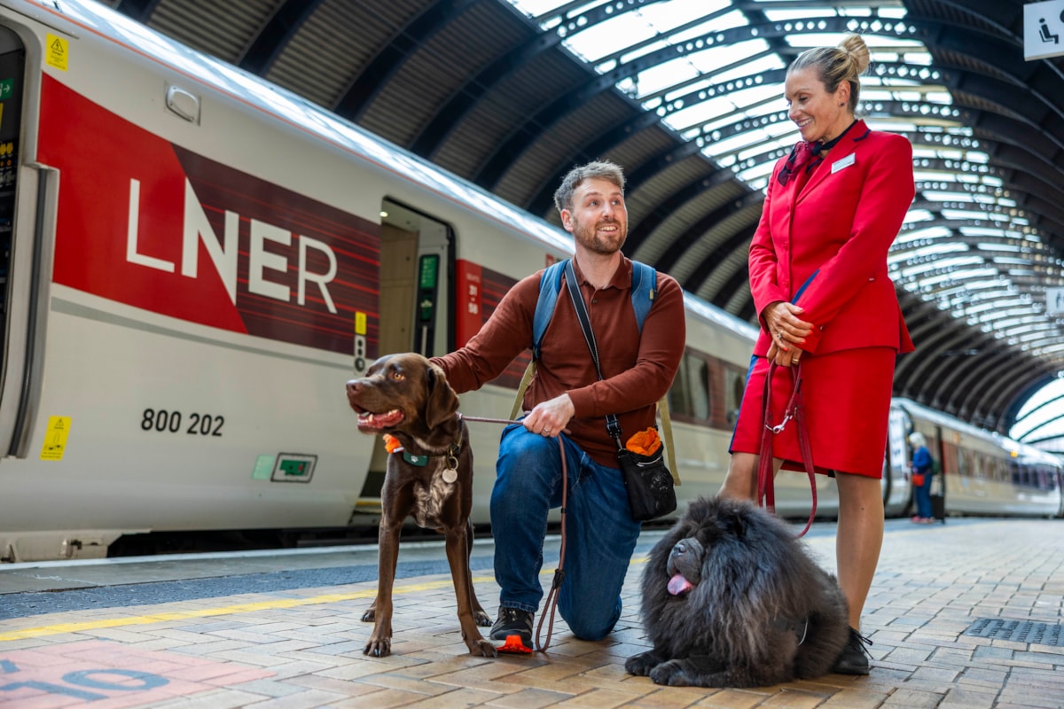 LNER Pet Champion with customer and dogs at York Station
