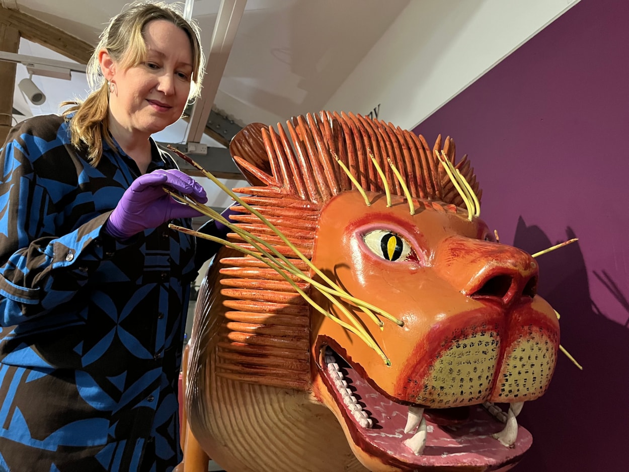 Living with Death: Kat Baxter, Leeds Museums and Galleries' curator of archaeology, with the lion coffin was made by world famous Ghanaian coffin carpenter Paa Joe.
Leeds City Museum’s Living with Death exhibition, which opens today (May 3) features a remarkable array of objects spanning thousands of years of world history and tradition which all explore how different cultures experience death, dying, and bereavement.