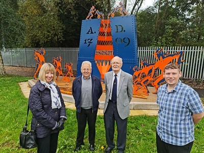 Abraham Darby Sculpture with (l-r) - Elaine Bouckley, Friends of Wrens Nest National Nature Reserve; Harry Brookes and Don Davies, Woodsetton Charitable Trust; and Cllr Simon Phipps cabinet member regenertaion and enterprise