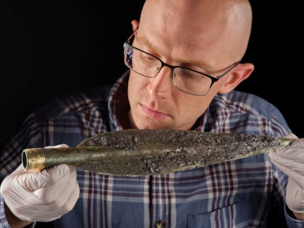 National Museums Scotland curator Dr Matthew Knight examines the Carnoustie Hoard. Photo © National Museums Scotland 4