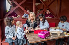 Natalie Thornton, Senior Project Coordinator at Siemens Mobility in Goole, with children from Airmyn Park Primary School in the new outdoor facility