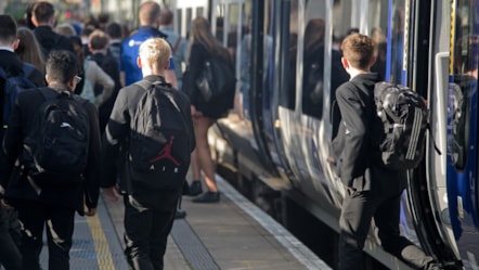 Image shows secondary school students commuting to school